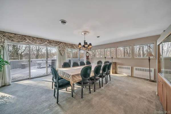 a dining room with furniture and window
