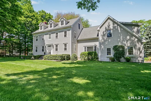 front view of a house with a garden