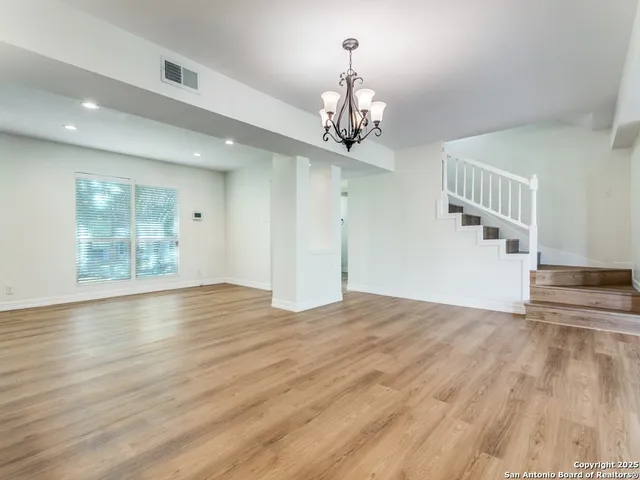 a view of livingroom with hardwood floor and hallway