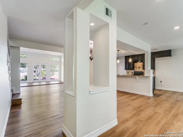 a view of a living room and hardwood floor