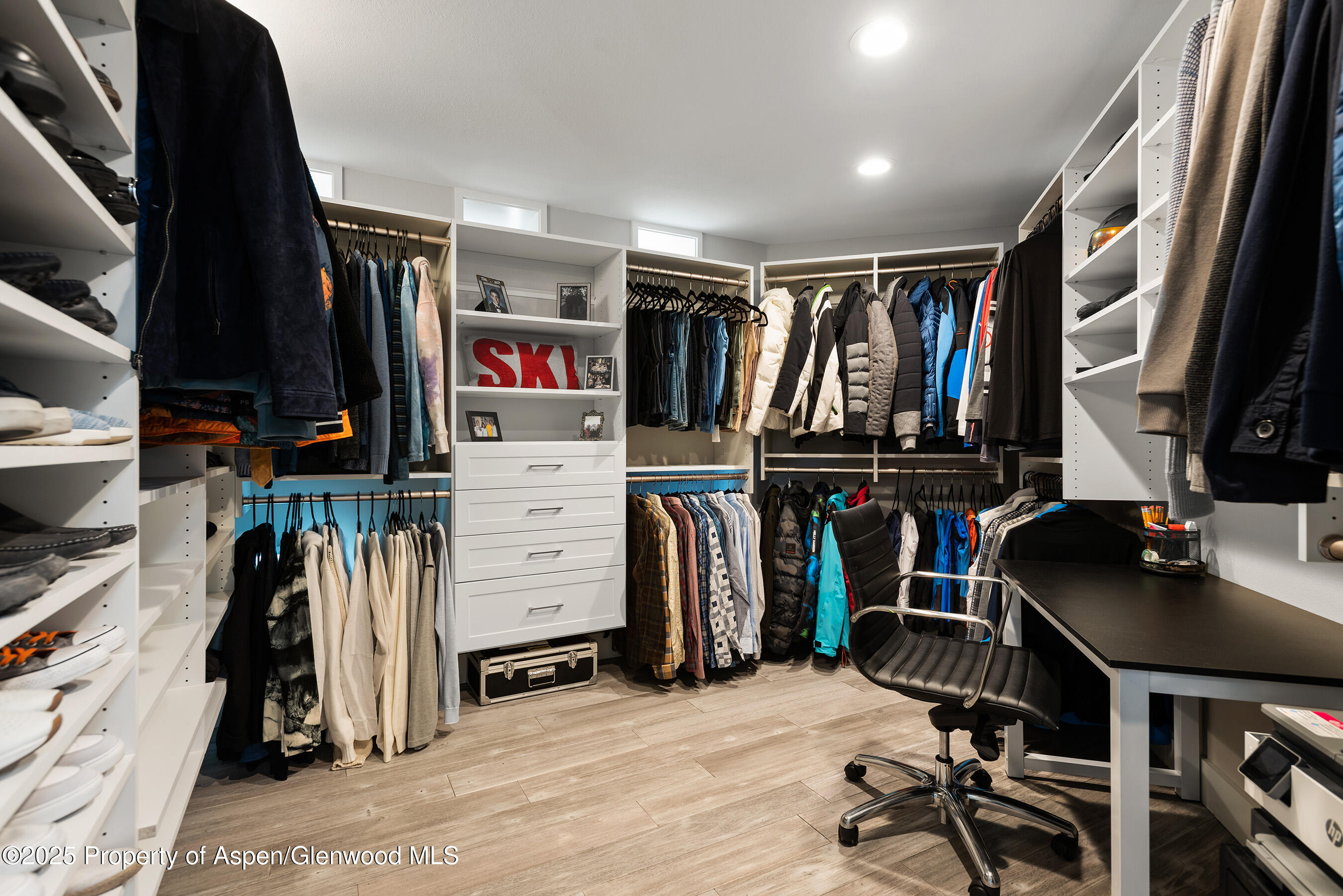 1167 Juniper Hill Road Aspen, CO 81611 - Photo 15 of 60 a view of walk in closet with clothes and shoes