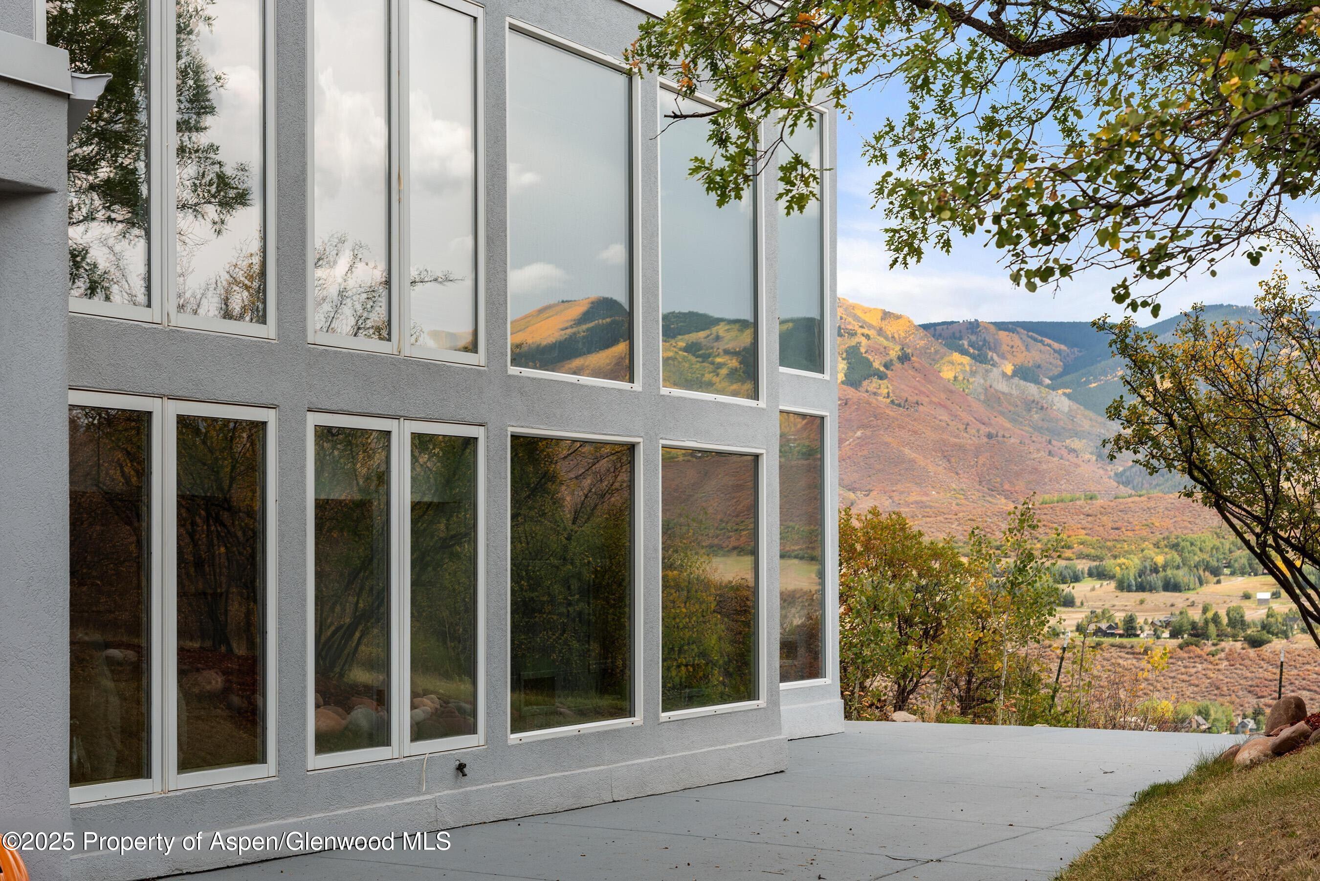 1167 Juniper Hill Road Aspen, CO 81611 - Photo 23 of 60 a view of a porch with a tree