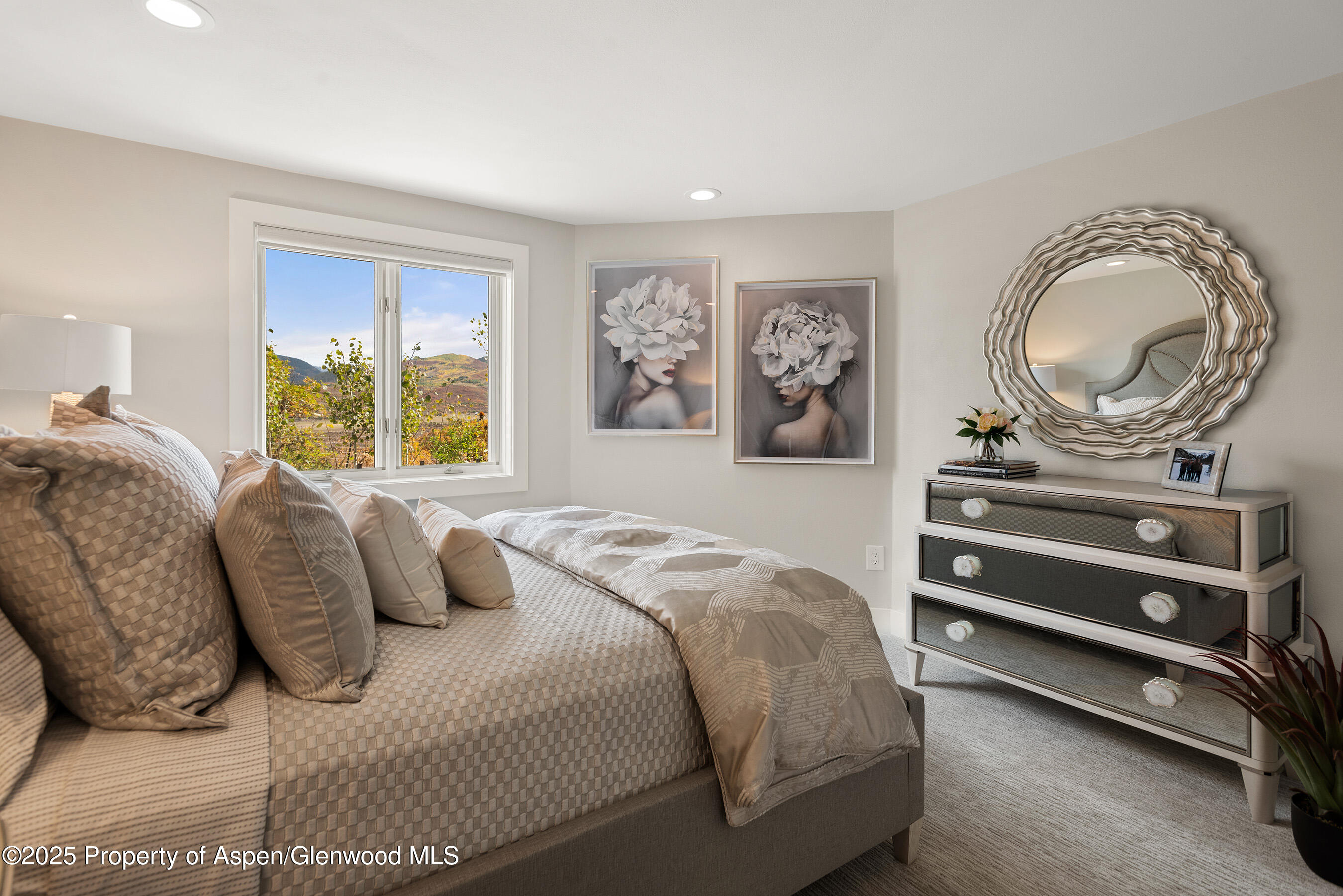 1167 Juniper Hill Road Aspen, CO 81611 - Photo 26 of 60 a bedroom with a bed and a dresser