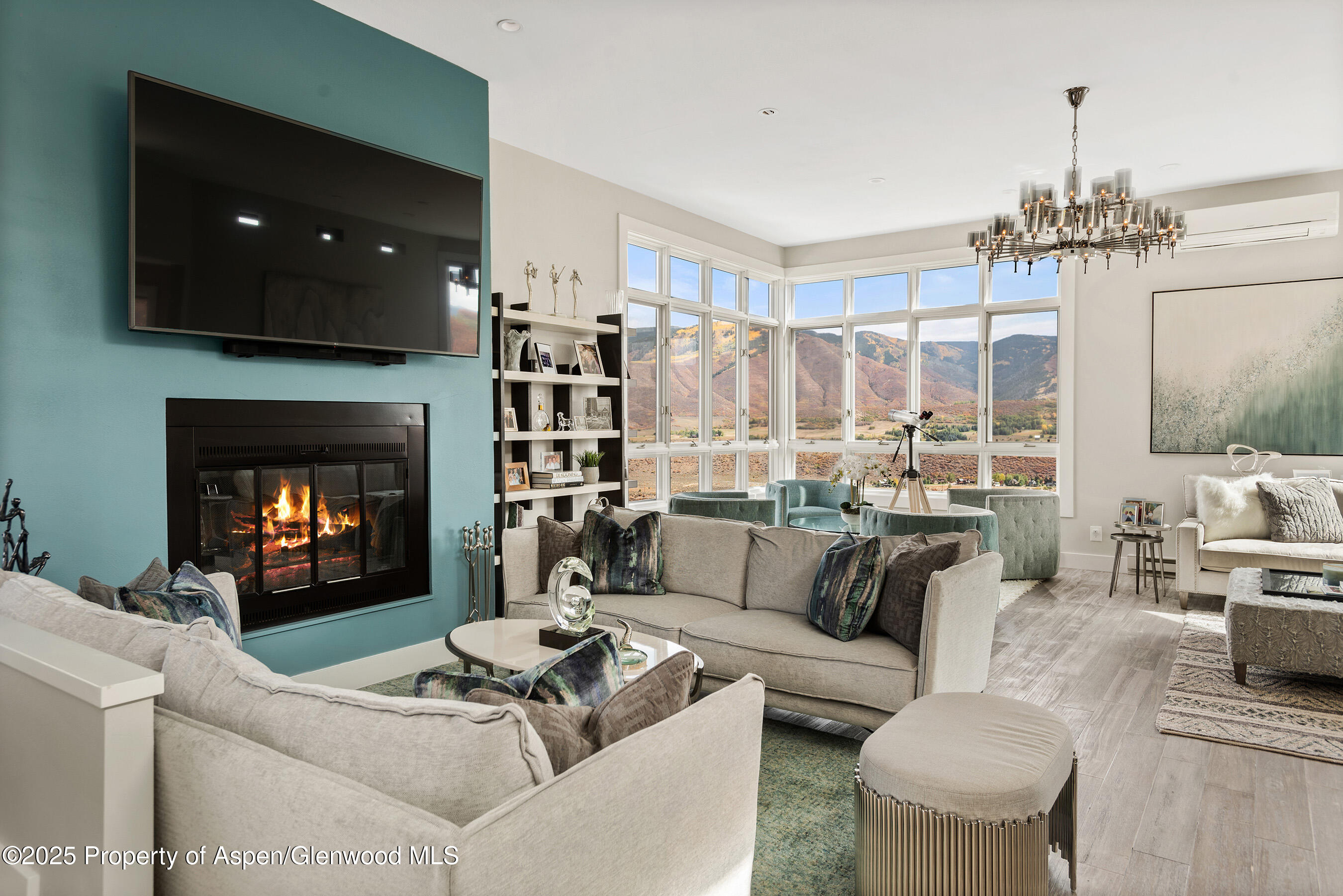 1167 Juniper Hill Road Aspen, CO 81611 - Photo 4 of 60 a living room with furniture and a fireplace