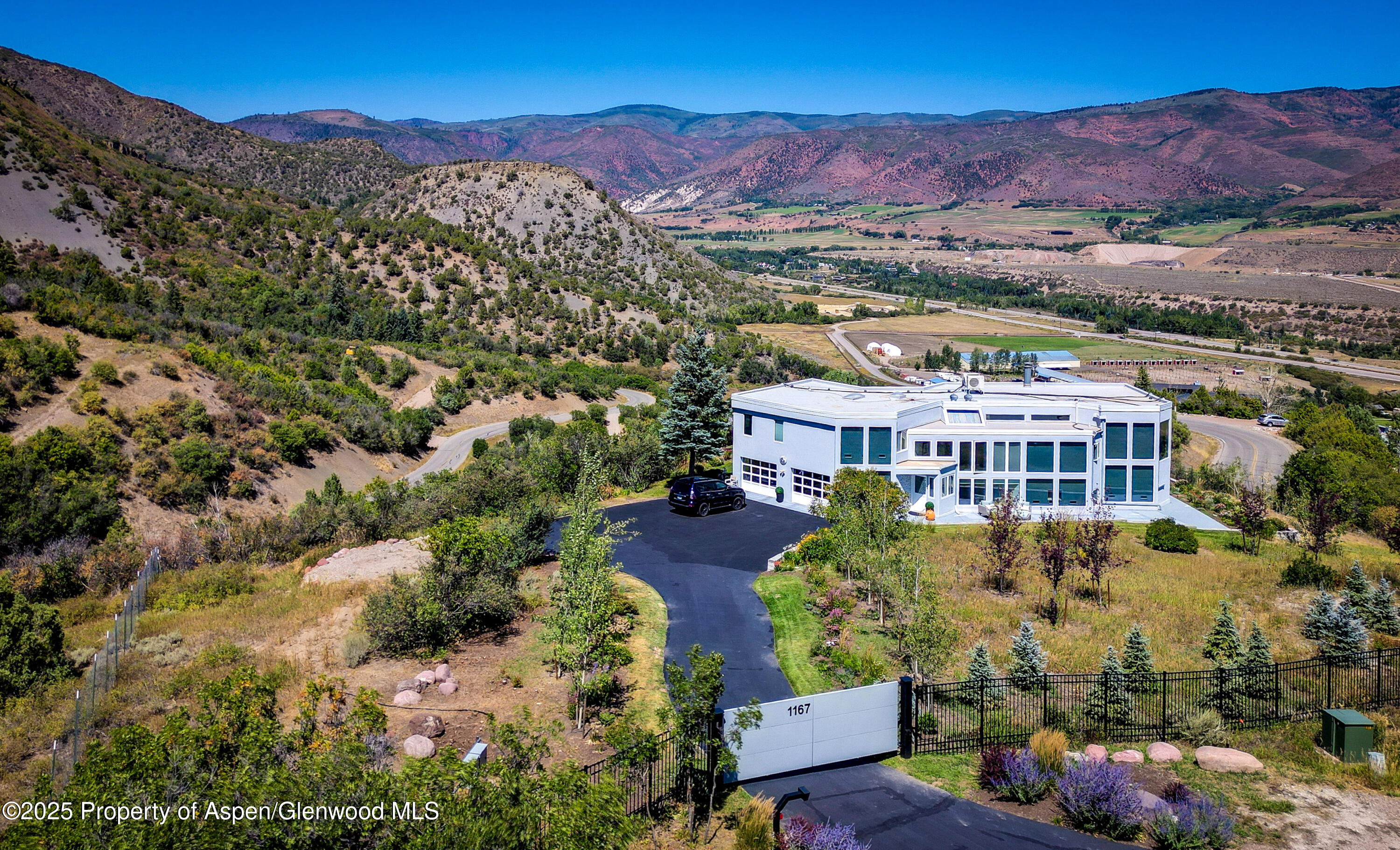 1167 Juniper Hill Road Aspen, CO 81611 - Photo 44 of 60 an aerial view of residential house with an outdoor space and mountain view