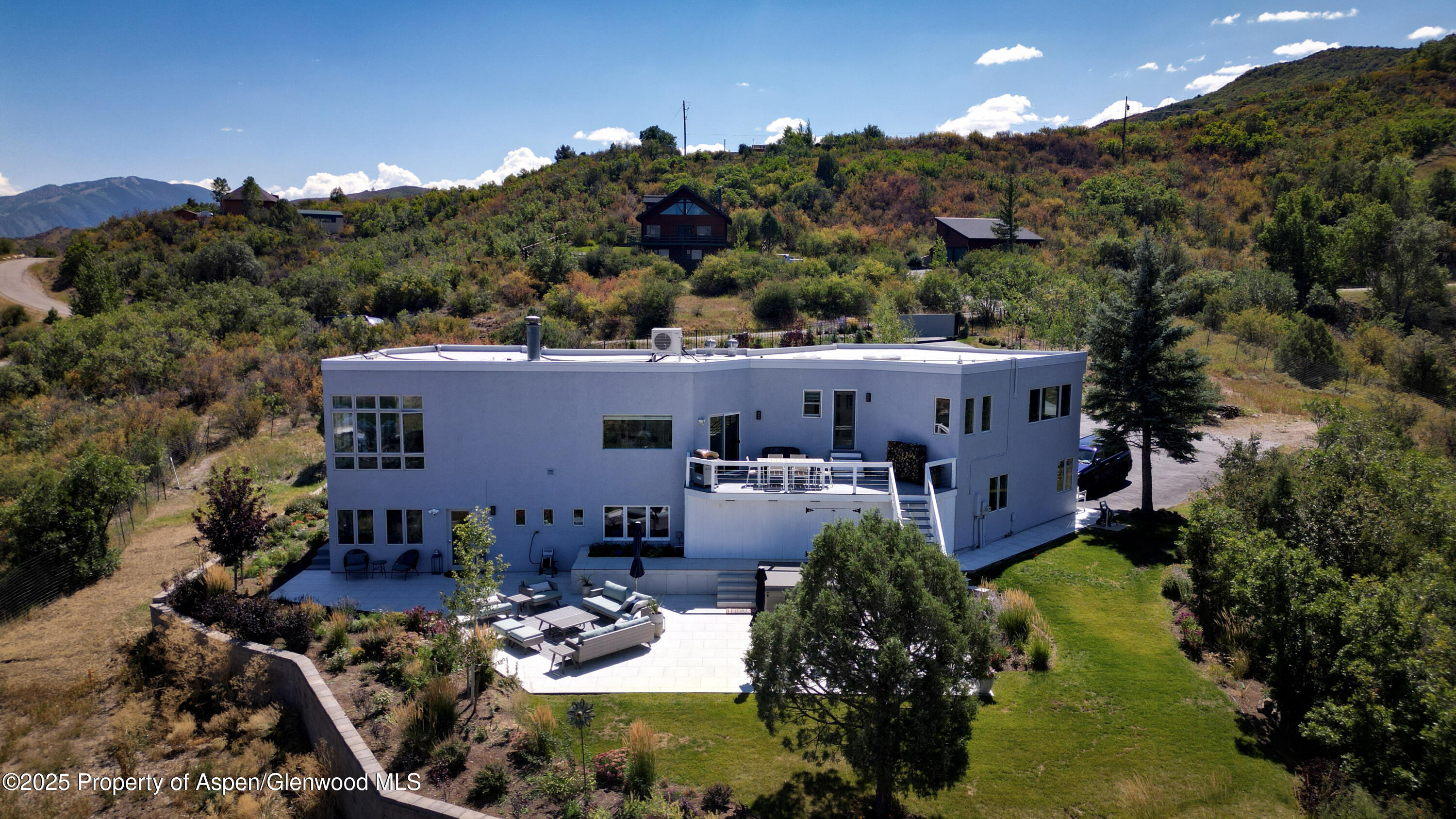 1167 Juniper Hill Road Aspen, CO 81611 - Photo 55 of 60 an aerial view of a house with a garden