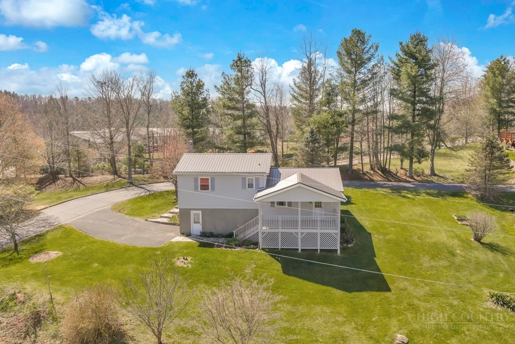 163 Rolling Hill Drive Boone, NC 28607 - Photo 3 of 40 a aerial view of a house with swimming pool