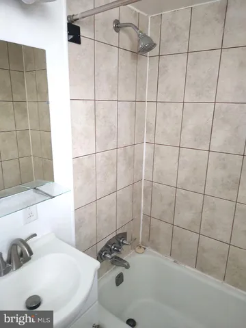 a bathroom with a sink and a shower