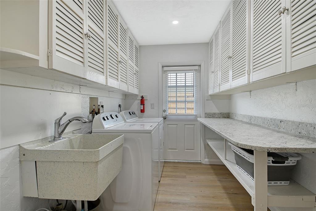 6722 Roxbury Drive Sarasota, FL 34231 - Photo 43 of 87 a kitchen with a sink cabinets and window