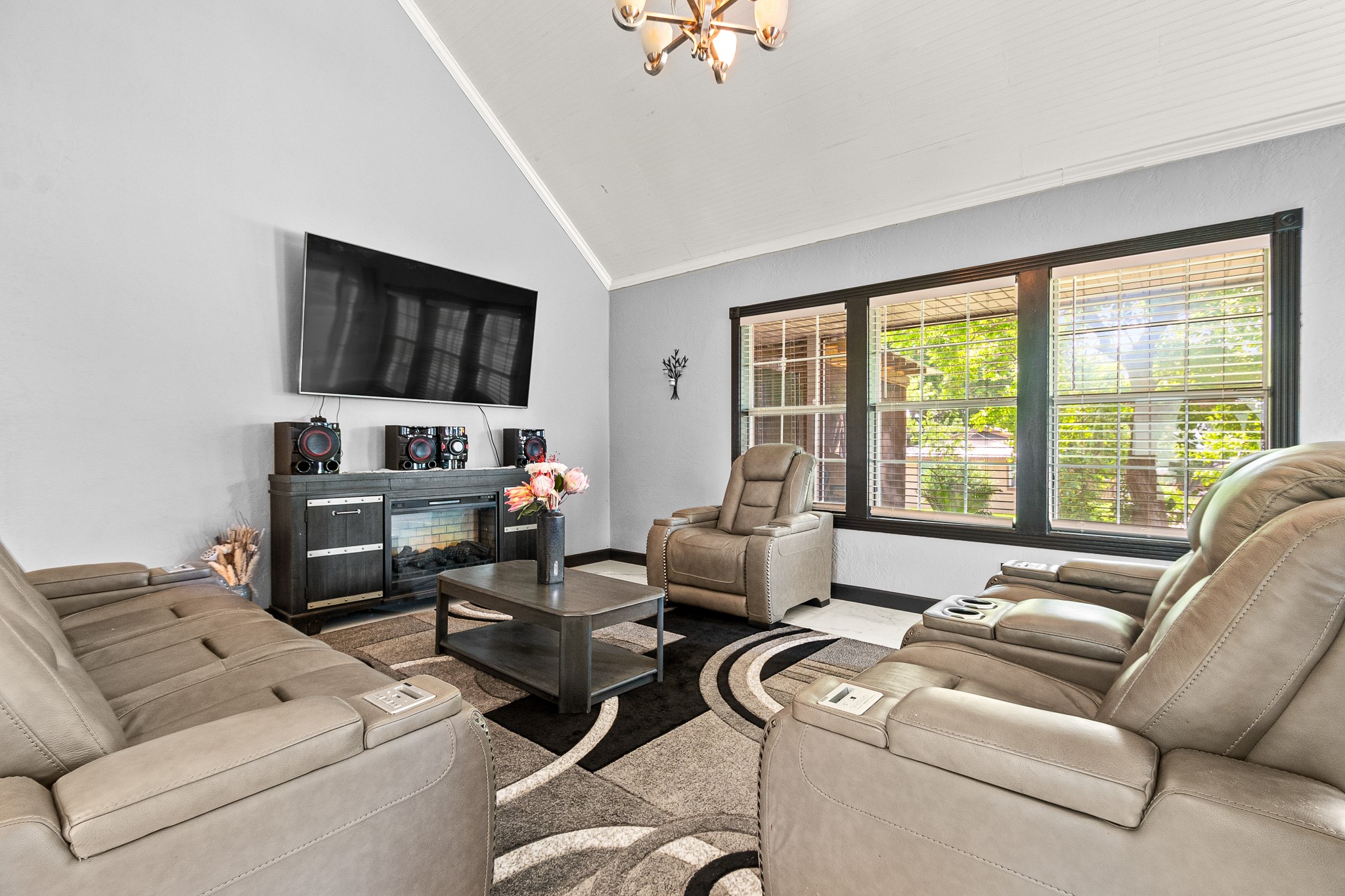 20 Clearview Point Blank, TX 77364 - Photo 2 of 38 a living room with furniture a flat screen tv and a large window