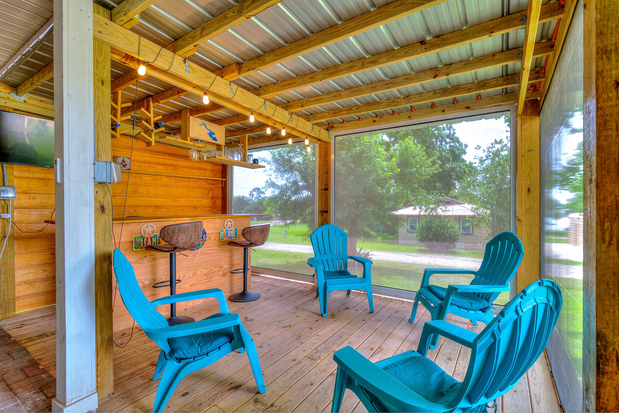 20 Clearview Point Blank, TX 77364 - Photo 27 of 38 a outdoor space with patio the couches and pool table with chairs next to a window