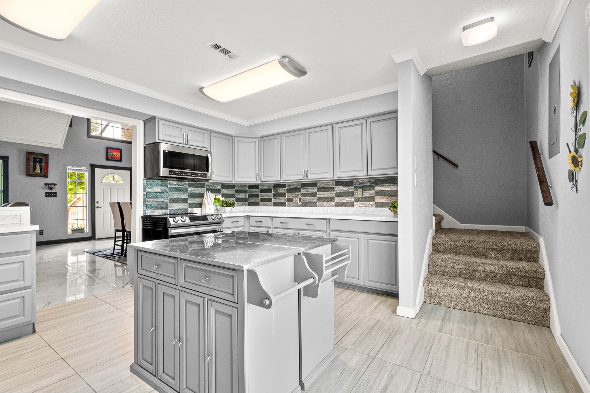 20 Clearview Point Blank, TX 77364 - Photo 8 of 38 a kitchen with stainless steel appliances a stove refrigerator sink and cabinets
