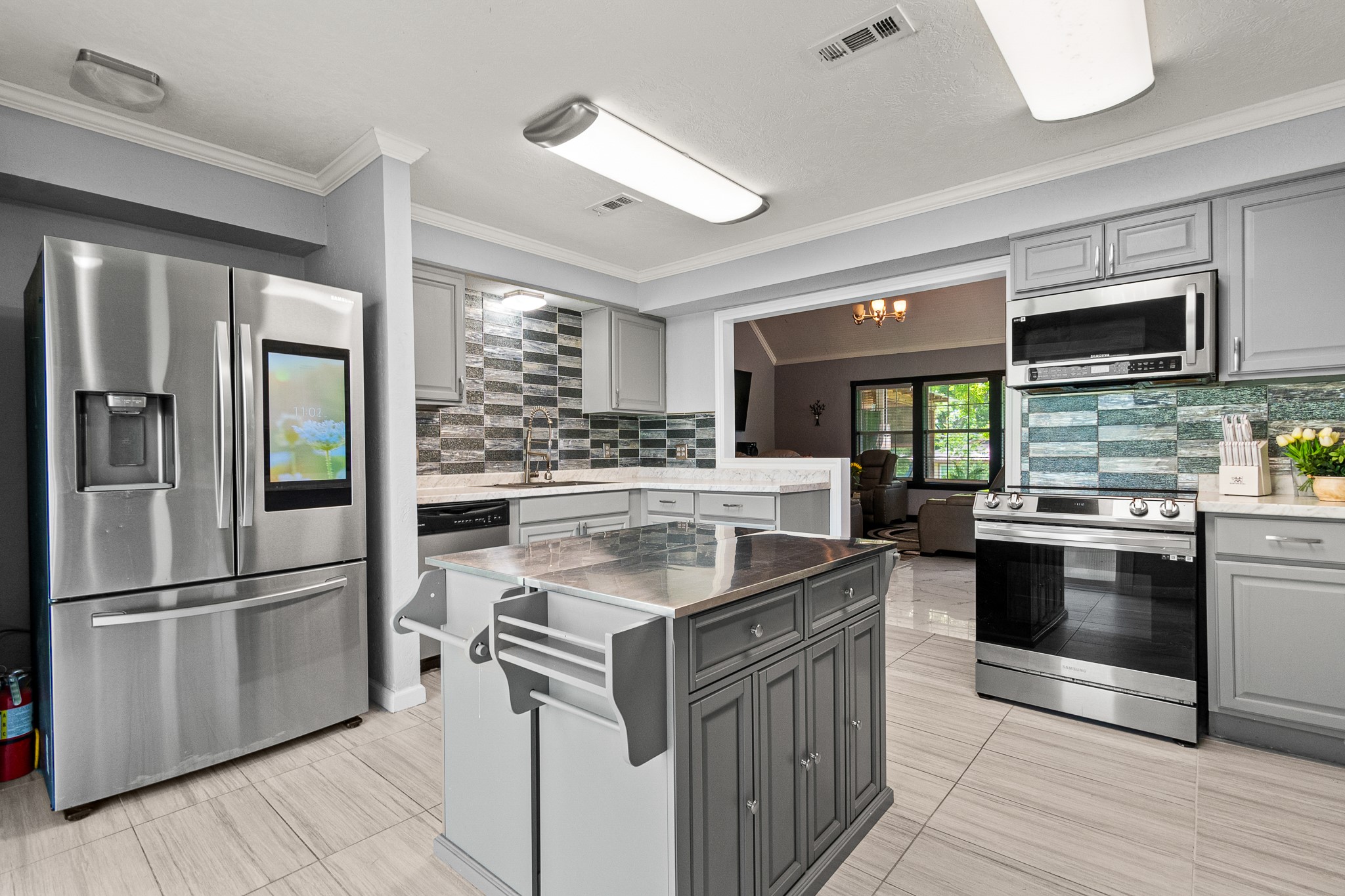 20 Clearview Point Blank, TX 77364 - Photo 9 of 38 a kitchen with stainless steel appliances granite countertop a refrigerator a stove and a sink
