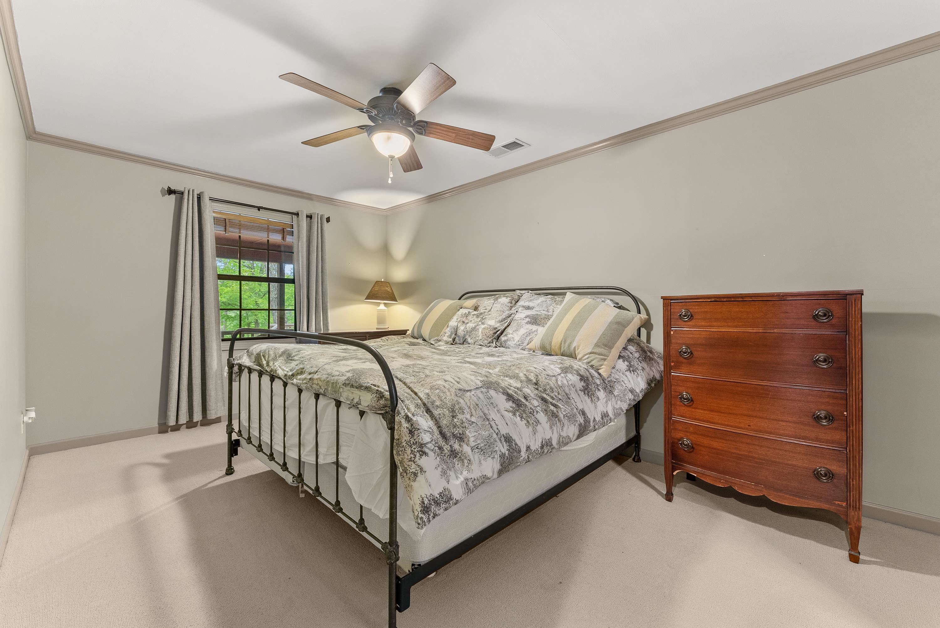 2275 Cypress Road Pocahontas, TN 38061 - Photo 22 of 34 Carpeted bedroom with baseboards, ornamental molding, and ceiling fan