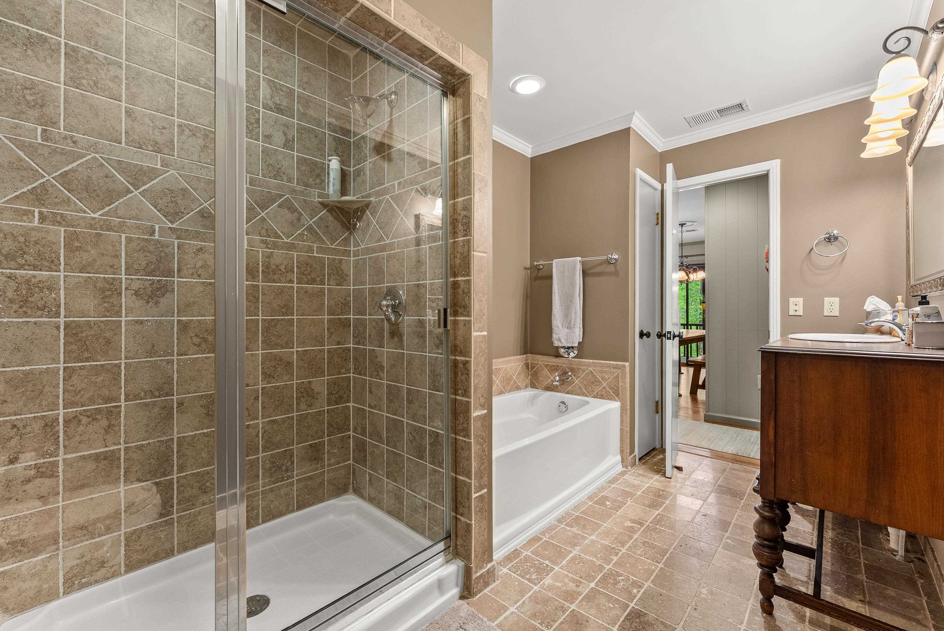 2275 Cypress Road Pocahontas, TN 38061 - Photo 25 of 34 Full bathroom featuring a stall shower, a garden tub, crown molding, and vanity