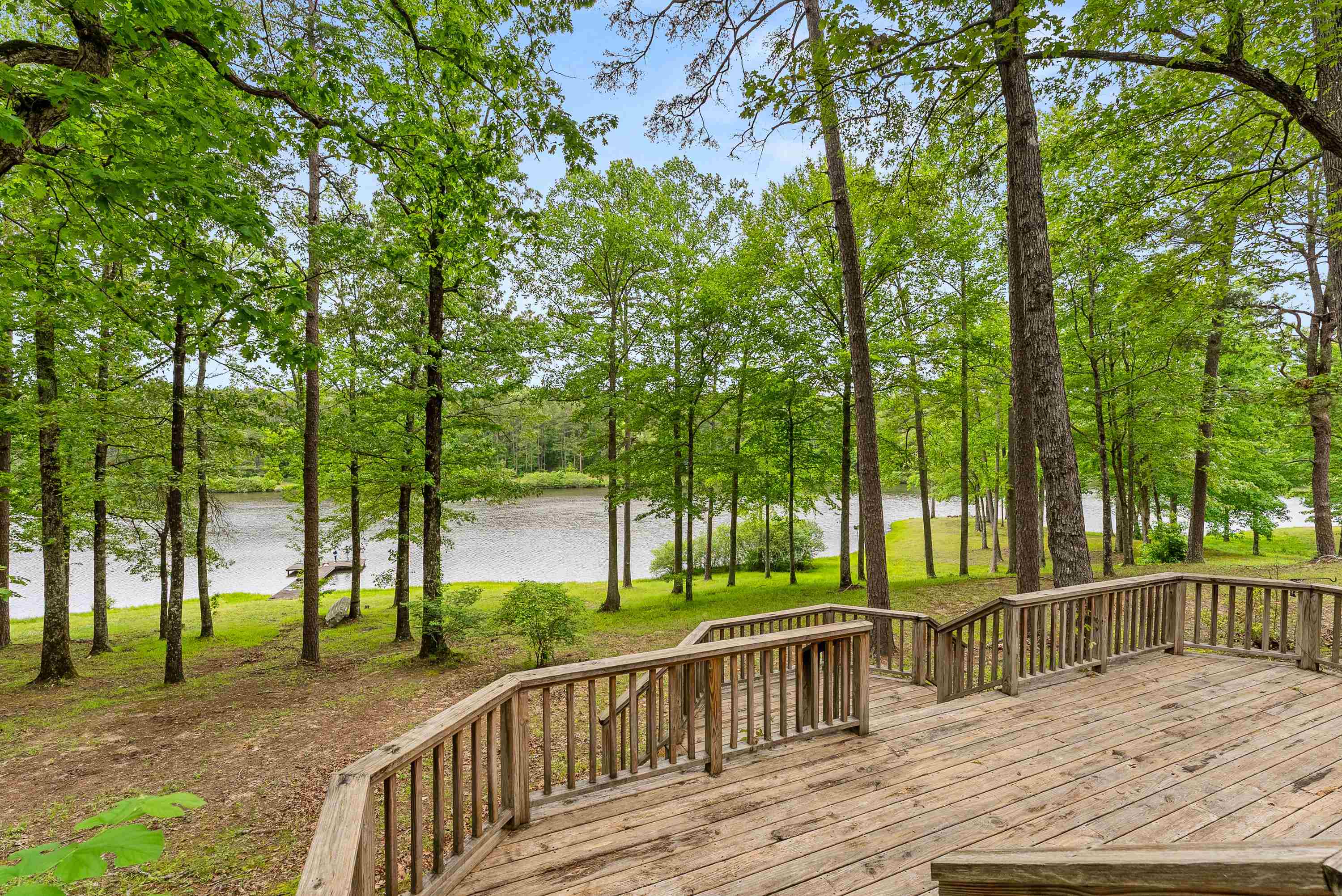 Wooden terrace featuring a water view
