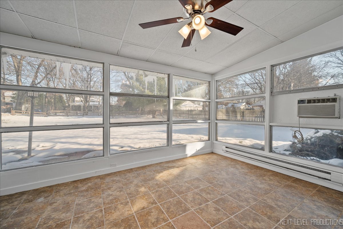 1326 South Elm Street St. Charles, IL 60174 - Photo 12 of 27 a view of an empty room and window with a ceiling fan