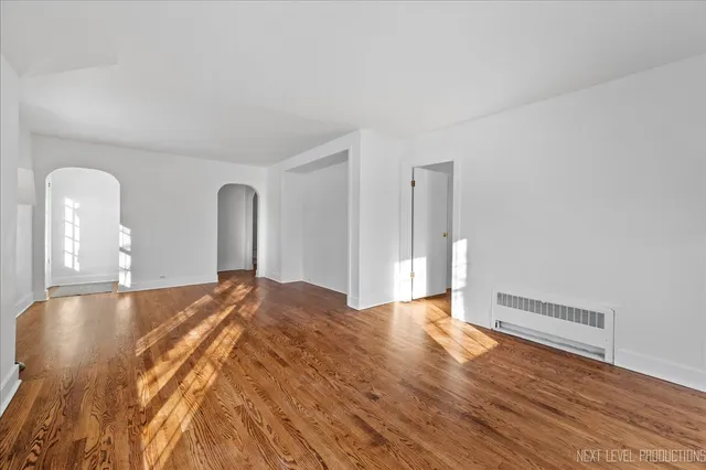 a view of a livingroom with wooden floor