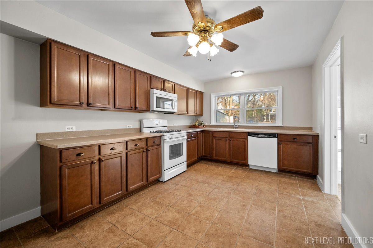 1326 South Elm Street St. Charles, IL 60174 - Photo 9 of 27 a kitchen with a stove sink and cabinets