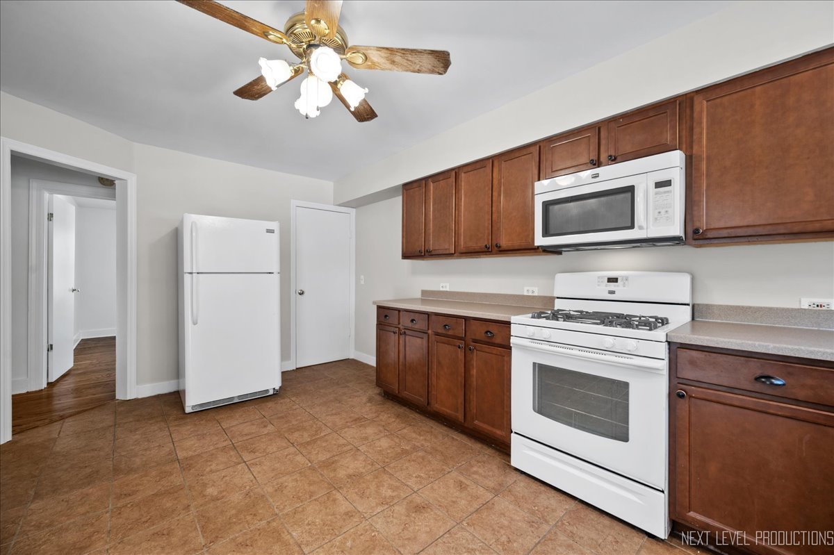 1326 South Elm Street St. Charles, IL 60174 - Photo 10 of 27 a kitchen with cabinets stainless steel appliances and a counter space