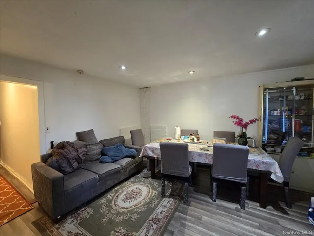 a living room with furniture a rug and a table