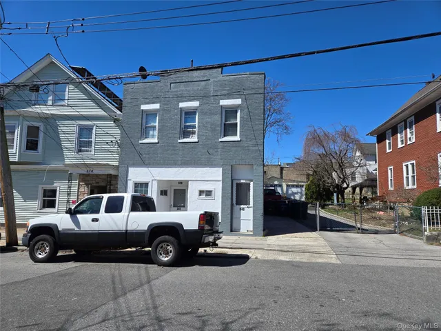 a view of a car parked in front of a building
