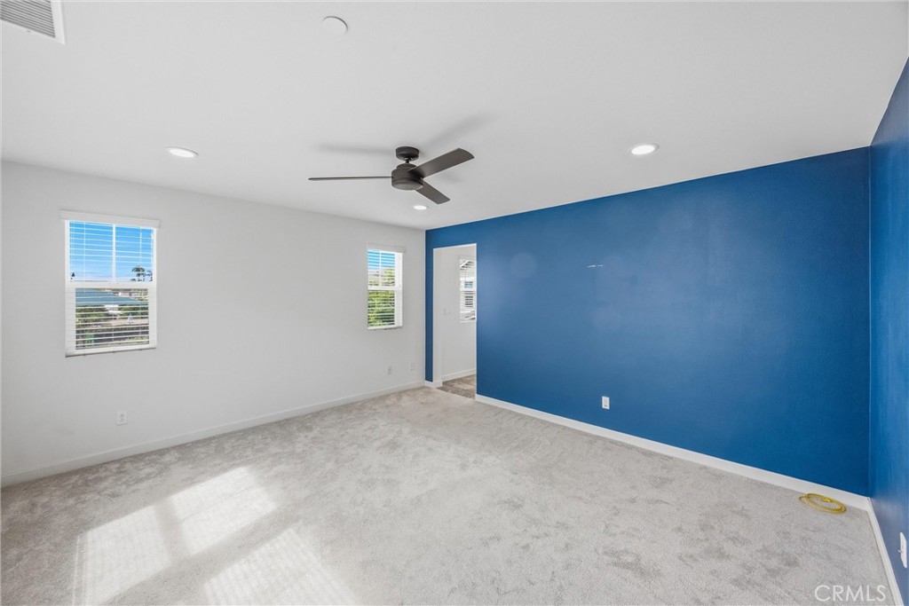 4247 Bravado Court Riverside, CA 92505 - Photo 36 of 60 Well-sized primary bedroom offers a comfortable and relaxing private retreat