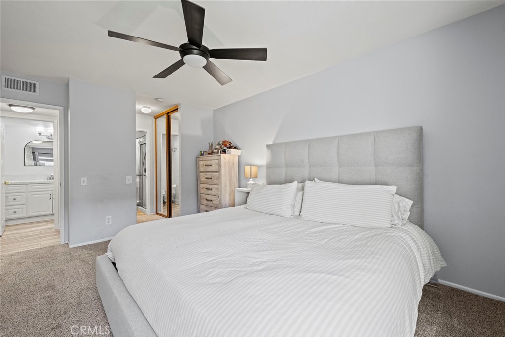 24243 Lema Drive Valencia, CA 91355 - Photo 14 of 37 a bedroom with a bed and a chandelier