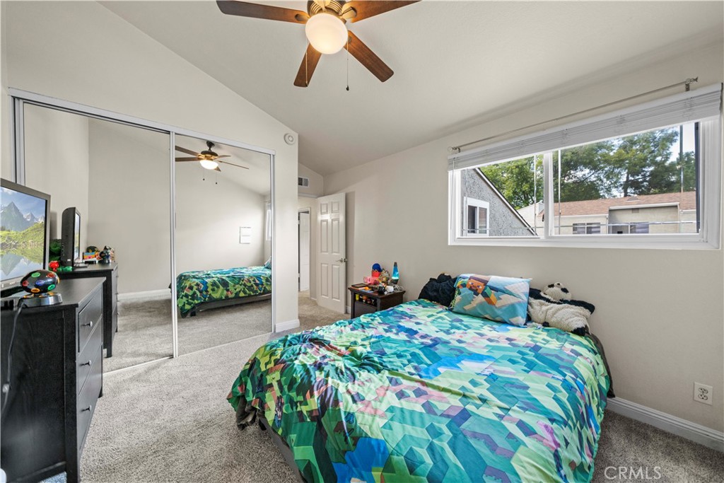 24243 Lema Drive Valencia, CA 91355 - Photo 18 of 37 a bedroom with a bed and a chandelier