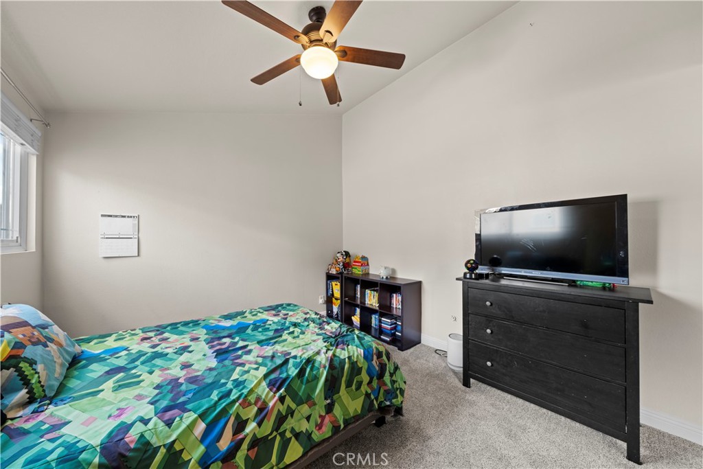 24243 Lema Drive Valencia, CA 91355 - Photo 19 of 37 a bedroom with a bed and a flat screen tv