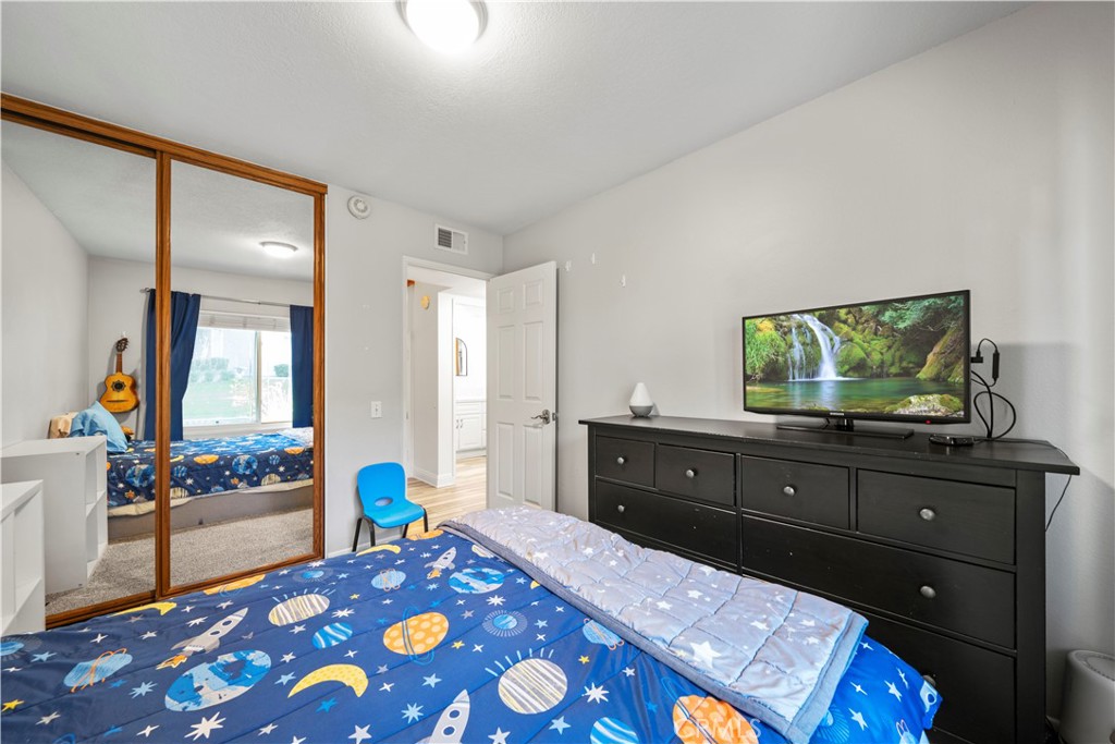 24243 Lema Drive Valencia, CA 91355 - Photo 24 of 37 a bedroom with a bed and a dresser in it