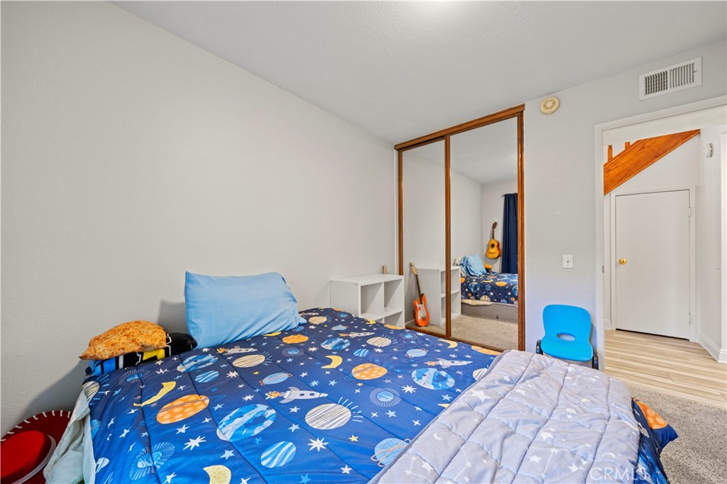 24243 Lema Drive Valencia, CA 91355 - Photo 25 of 37 a bedroom with 2 bed and a lamp on dresser