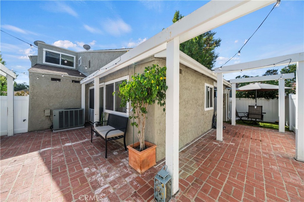 24243 Lema Drive Valencia, CA 91355 - Photo 32 of 37 a view of a porch with furniture and a yard