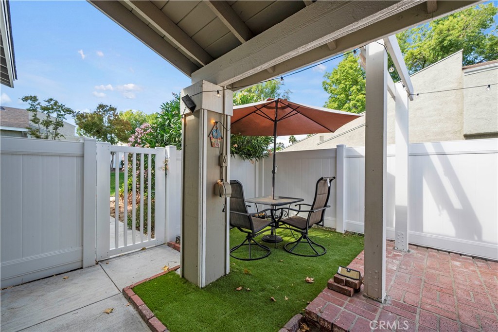 24243 Lema Drive Valencia, CA 91355 - Photo 35 of 37 a view of a chair and table in backyard of the house