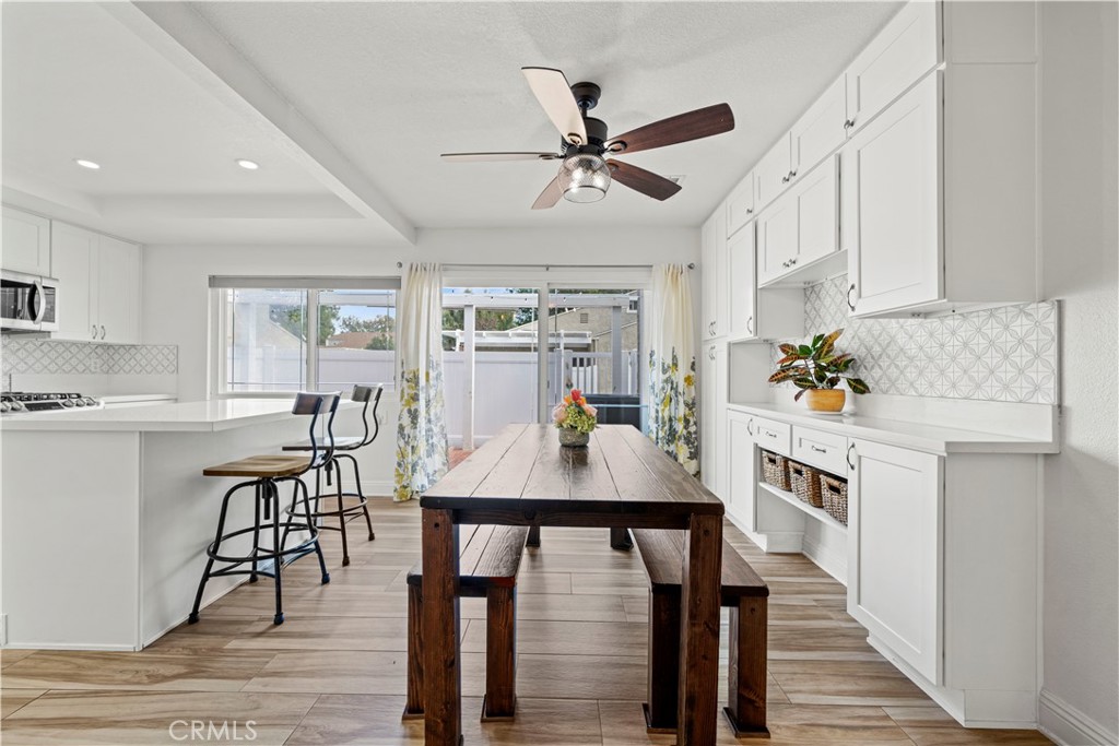 24243 Lema Drive Valencia, CA 91355 - Photo 6 of 37 a view of a dining room with furniture window and wooden floor
