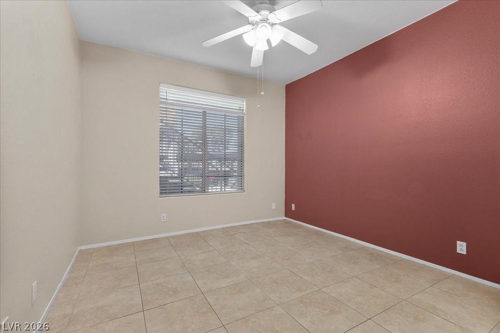2201 Ramsgate Drive, Unit 818 Henderson, NV 89074 - Photo 11 of 31 Empty room featuring ceiling fan and light tile patterned flooring