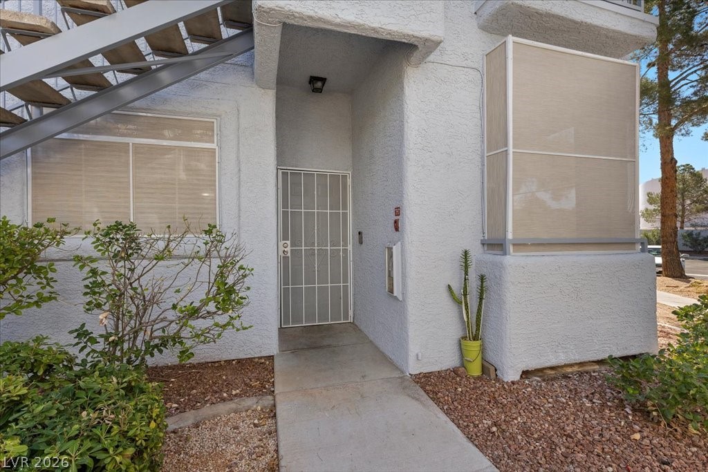2201 Ramsgate Drive, Unit 818 Henderson, NV 89074 - Photo 19 of 31 Doorway to property with stucco siding
