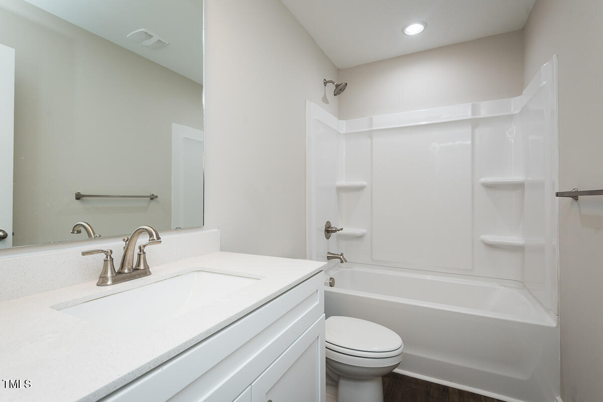 1016 Pinnix Loop Burlington, NC 27217 - Photo 13 of 22 a bathroom with a sink toilet and a bathtub