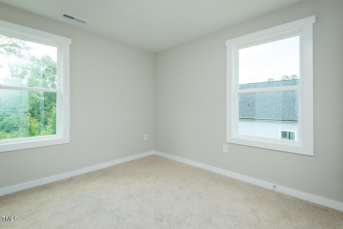 1016 Pinnix Loop Burlington, NC 27217 - Photo 14 of 22 an empty room with a window