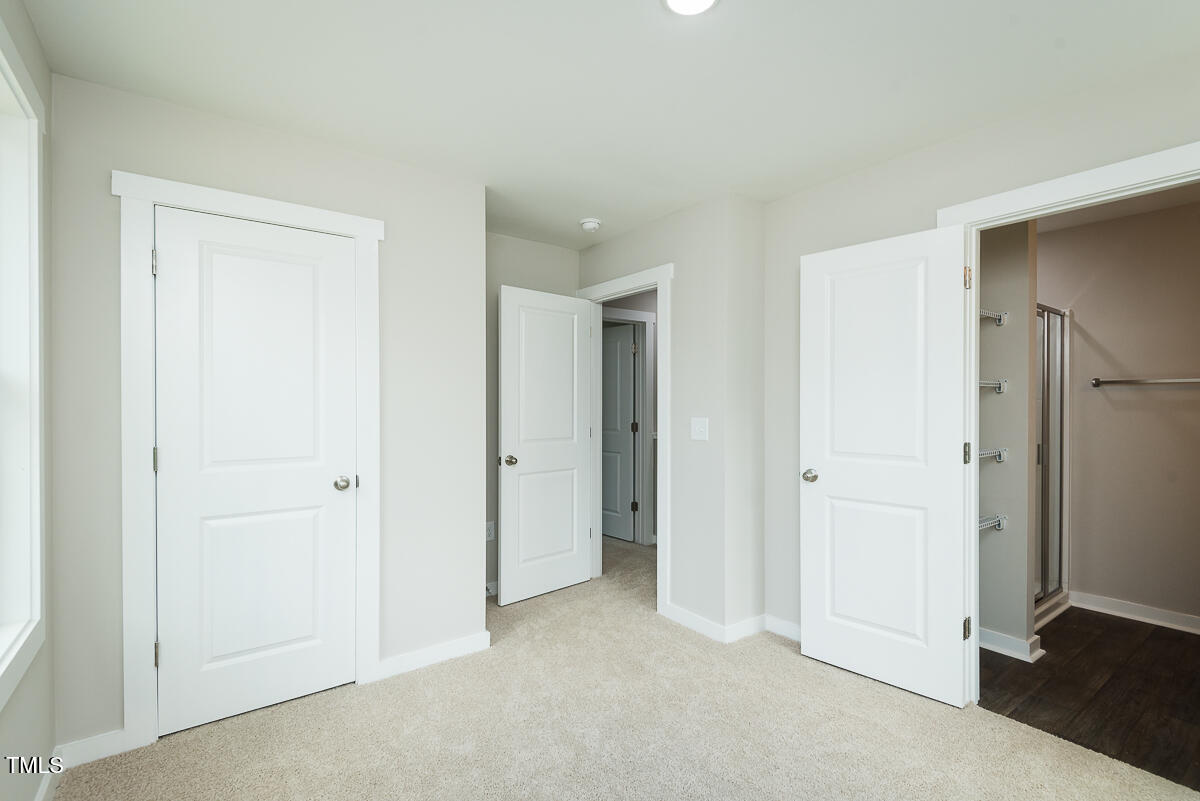 1016 Pinnix Loop Burlington, NC 27217 - Photo 17 of 22 a view of an empty room and closet area
