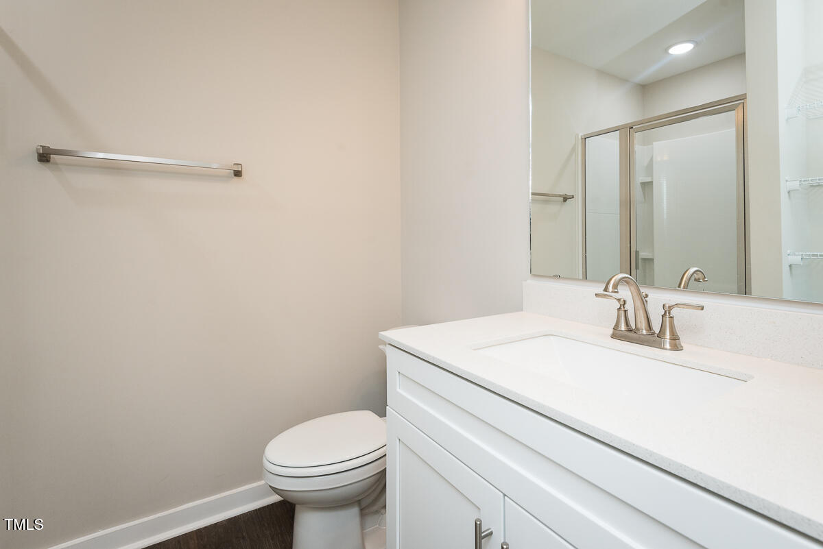 1016 Pinnix Loop Burlington, NC 27217 - Photo 18 of 22 a bathroom with a sink toilet and a mirror