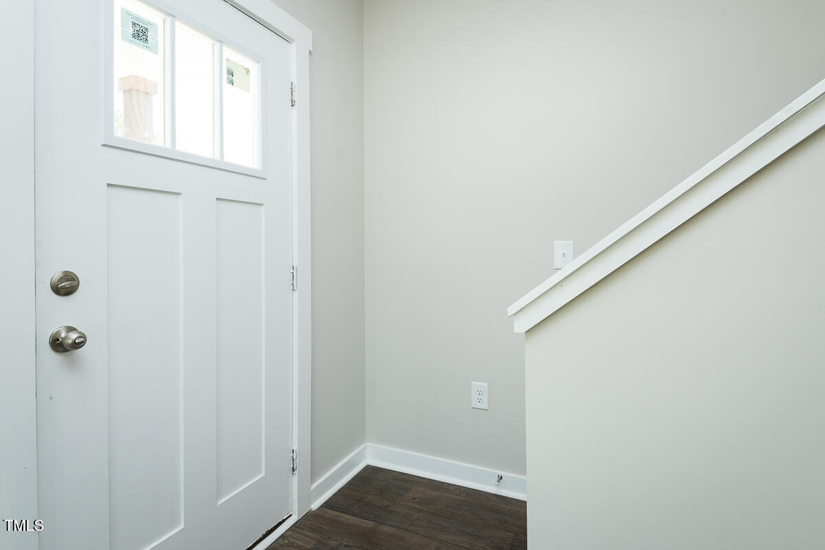 1016 Pinnix Loop Burlington, NC 27217 - Photo 9 of 22 a view of a hallway with wooden floor