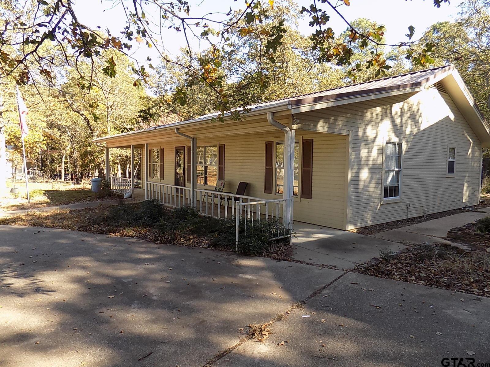 111 Laurel Lane Holly Lake Ranch, TX 75765 - Photo 1 of 43 a view of a house with a yard
