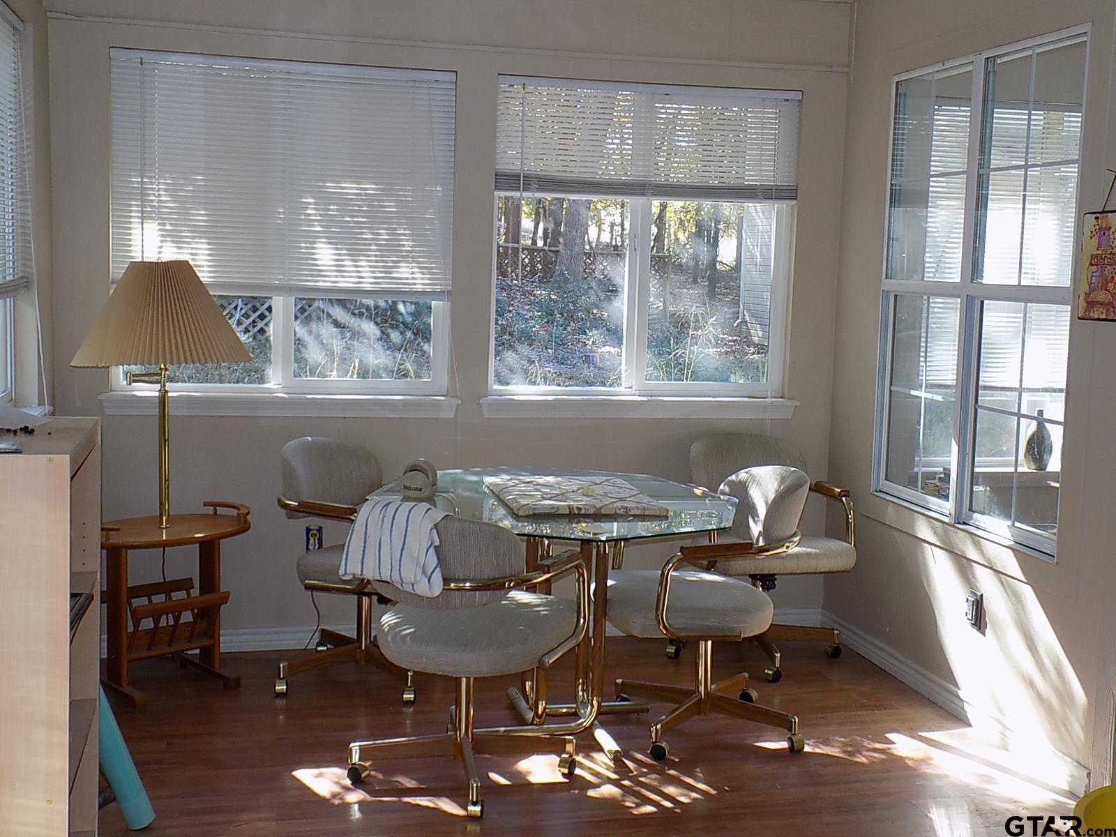 111 Laurel Lane Holly Lake Ranch, TX 75765 - Photo 19 of 43 a view of a dining room with furniture window and outside view