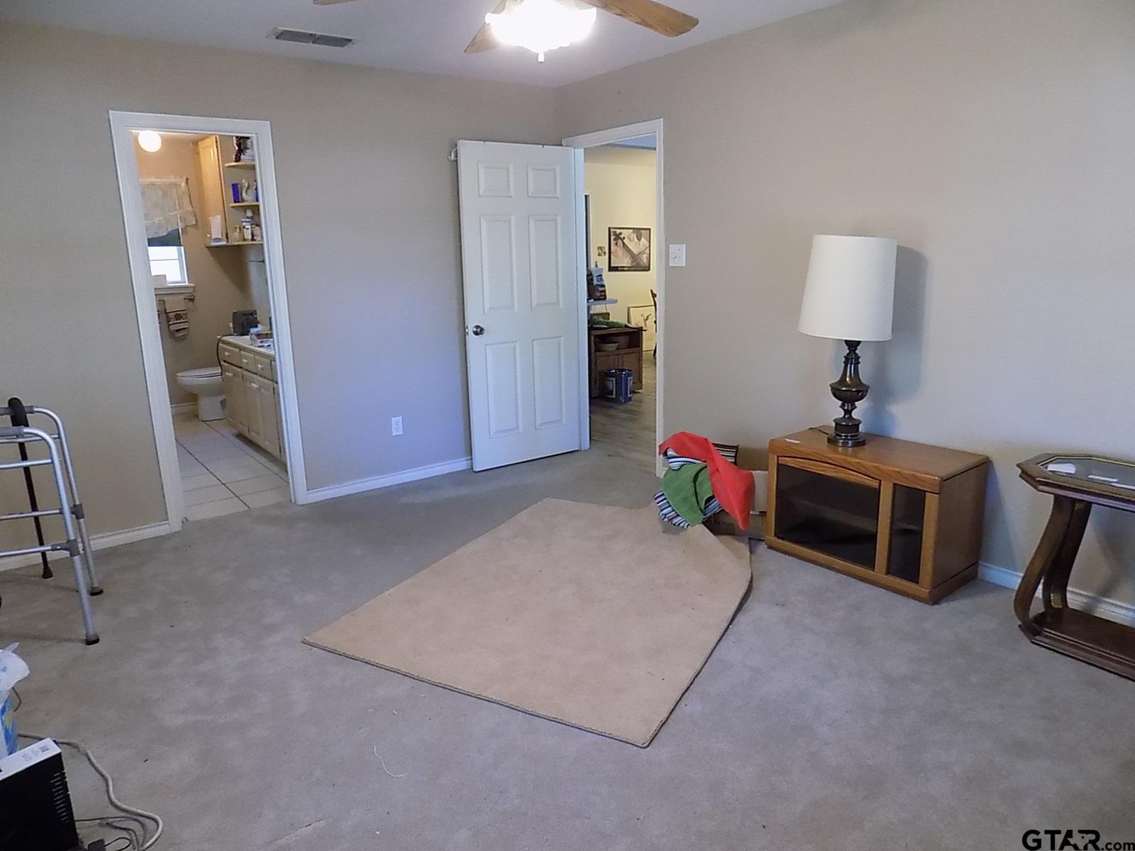 111 Laurel Lane Holly Lake Ranch, TX 75765 - Photo 25 of 43 a living room with furniture and a table