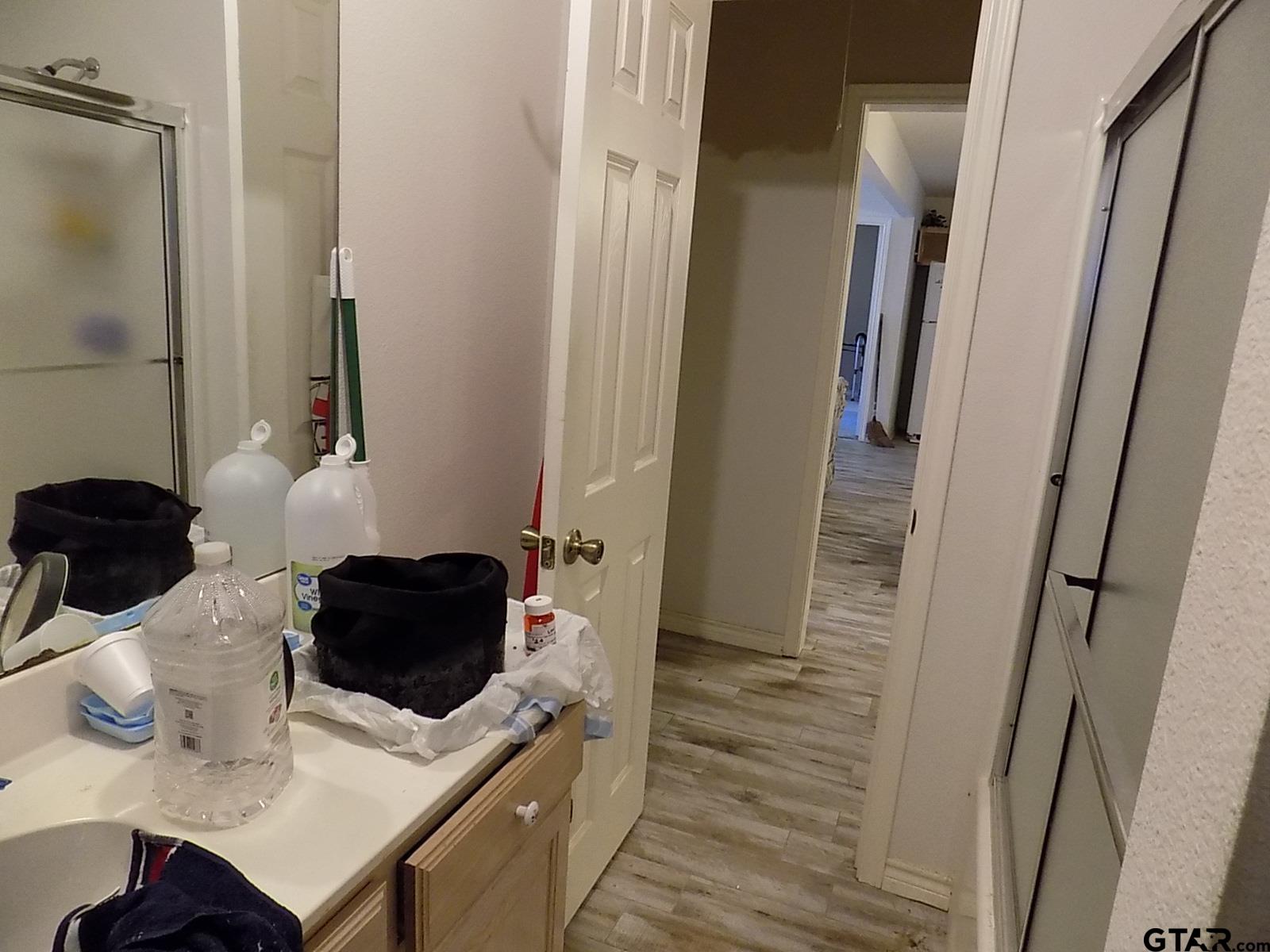 111 Laurel Lane Holly Lake Ranch, TX 75765 - Photo 29 of 43 a bedroom with a bed and a furniture