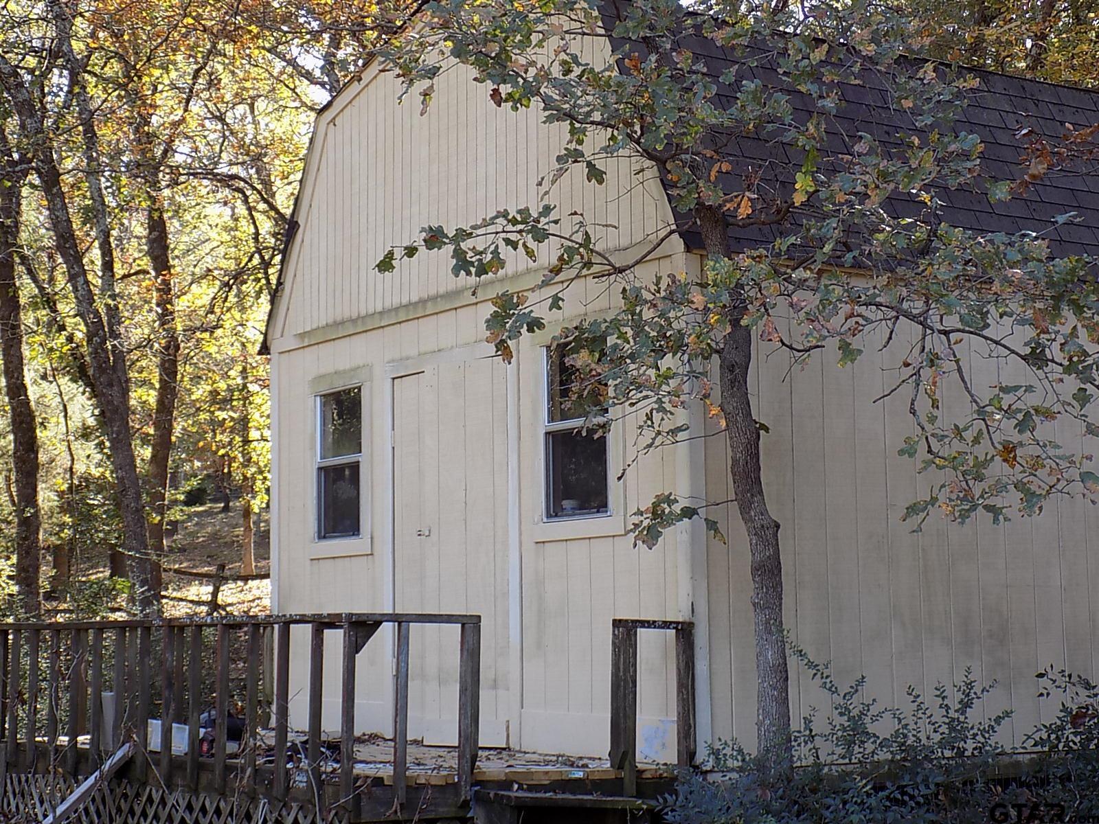 111 Laurel Lane Holly Lake Ranch, TX 75765 - Photo 29 of 43 a view of a house with a tree
