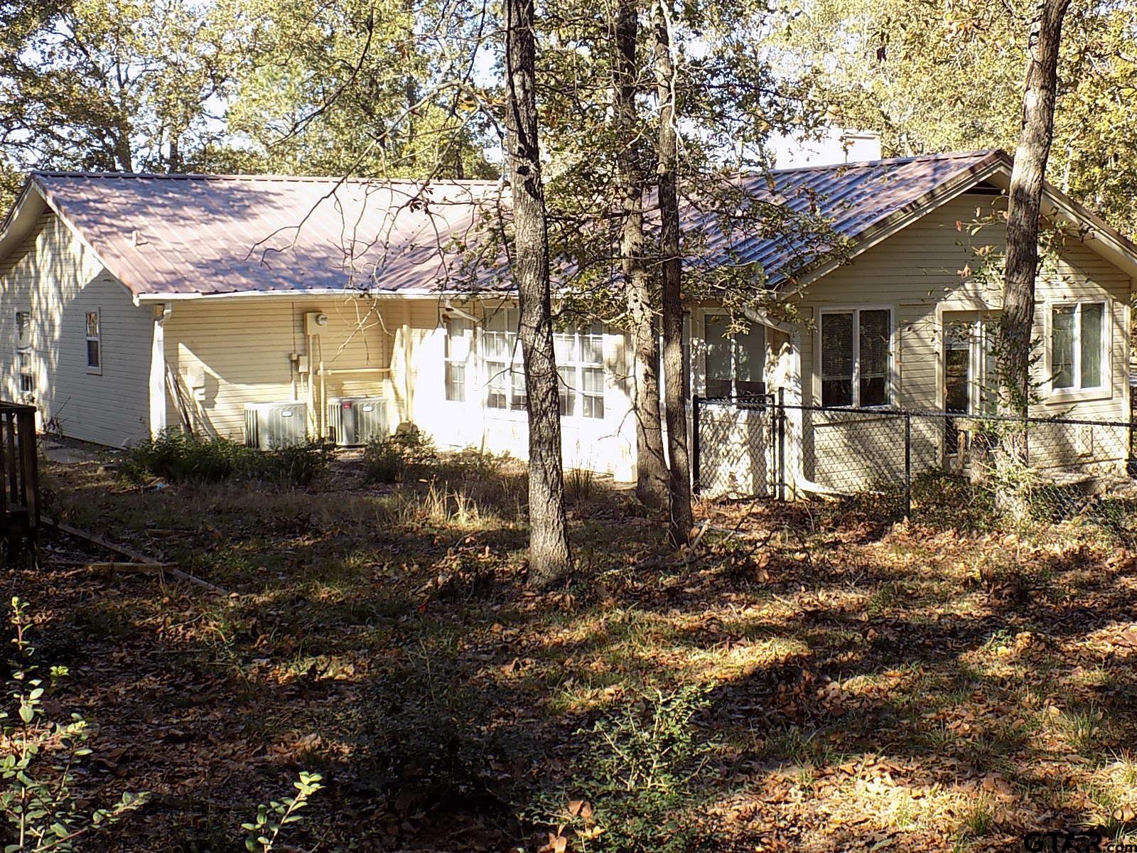 111 Laurel Lane Holly Lake Ranch, TX 75765 - Photo 10 of 43 a view of a house with a yard