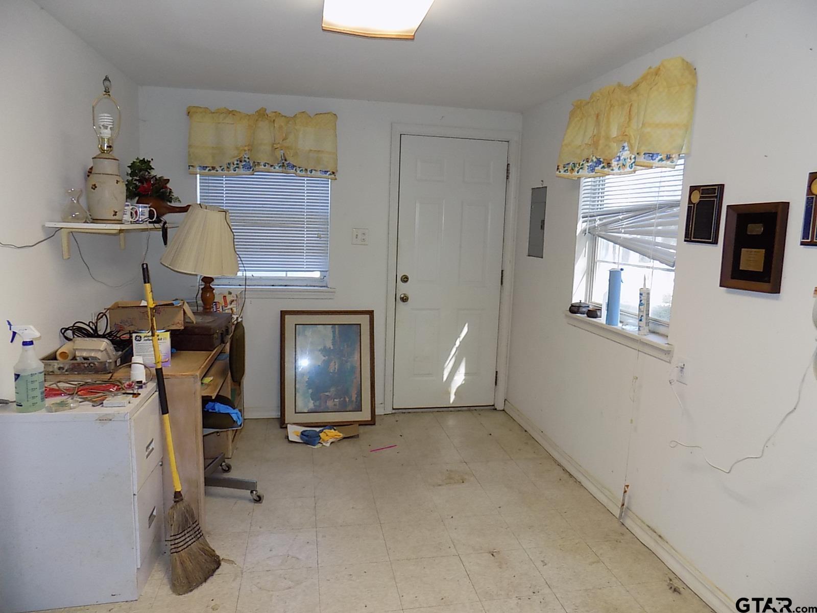 111 Laurel Lane Holly Lake Ranch, TX 75765 - Photo 10 of 43 a view of a workspace with furniture and a window