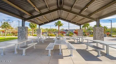 a view of a swimming pool with a patio and a garden